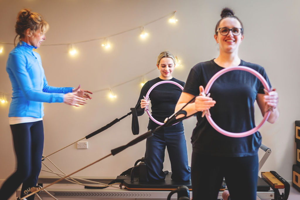 Small group mat class with magic circles and string lights